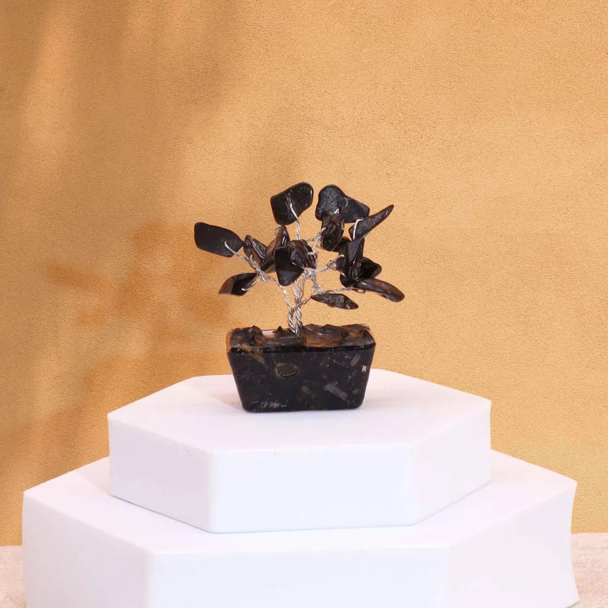 Mini gemstone tree ornament with 15 black agate stones on a square orgonite base, shown on white background