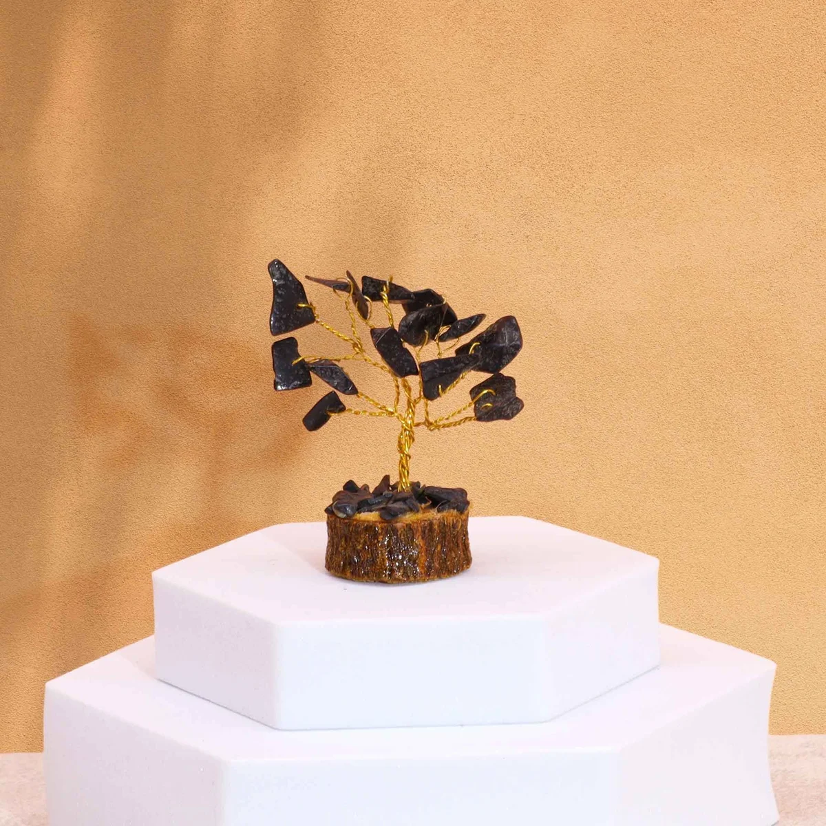 Mini gemstone tree with 15 black agate stones on a wooden base displayed on white background