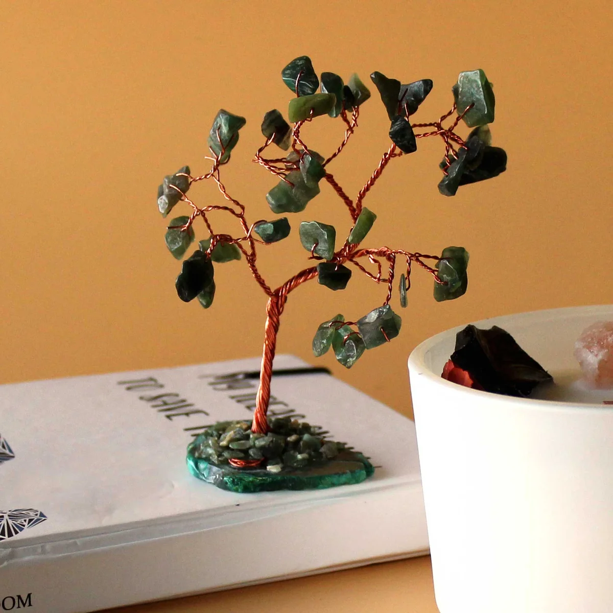 Green aventurine gemstone tree with 35 stones on a polished green agate base displayed on white background
