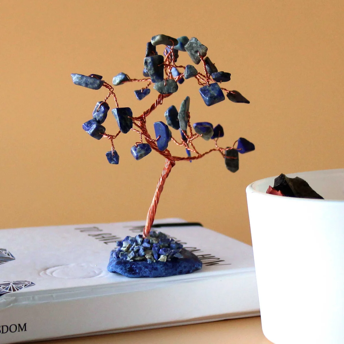 Sodalite gemstone tree with 35 stones on a polished blue agate base, decorative crystal display
