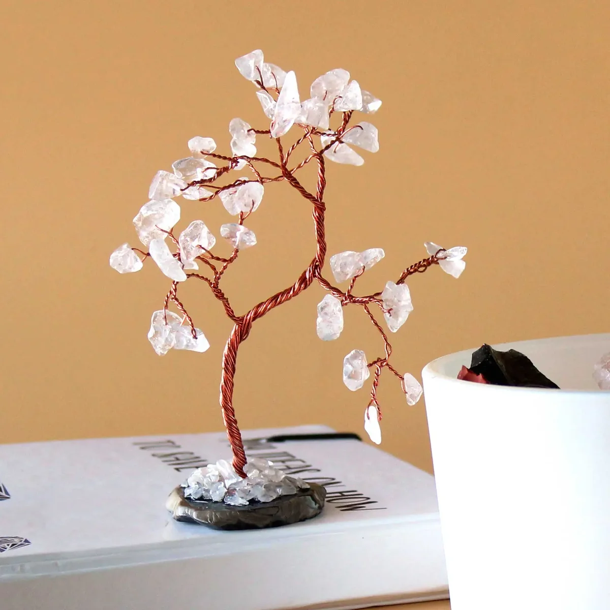 Gemstone tree with 35 rock quartz stones on a black agate base ornament, decorative and polished display piece