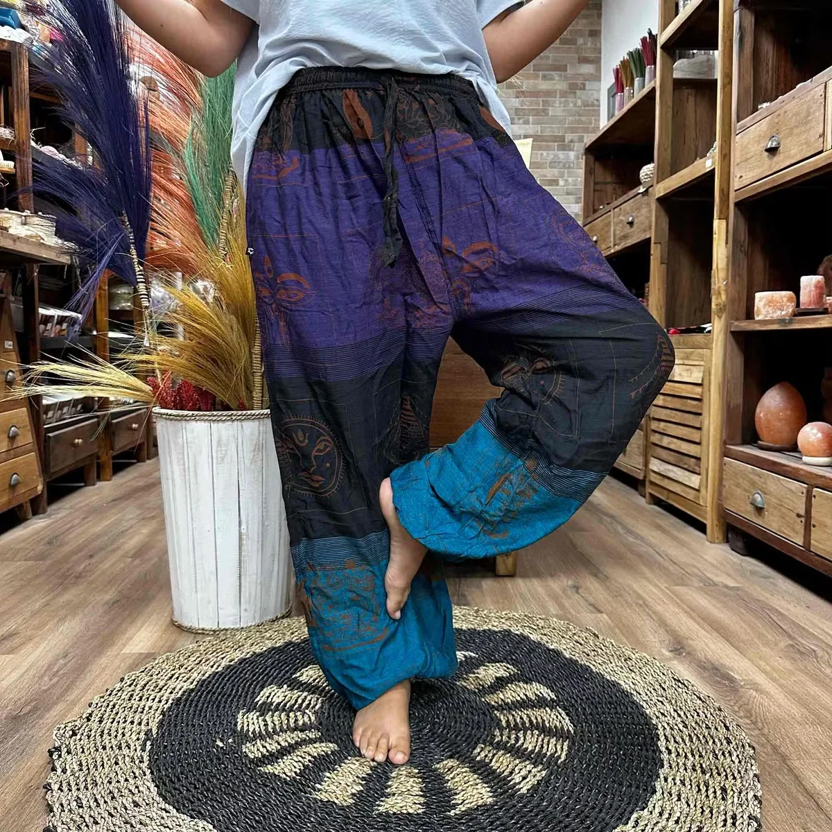 Purple yoga pants with high cross Himalayan print, designed for yoga and festival wear, shown on plain background