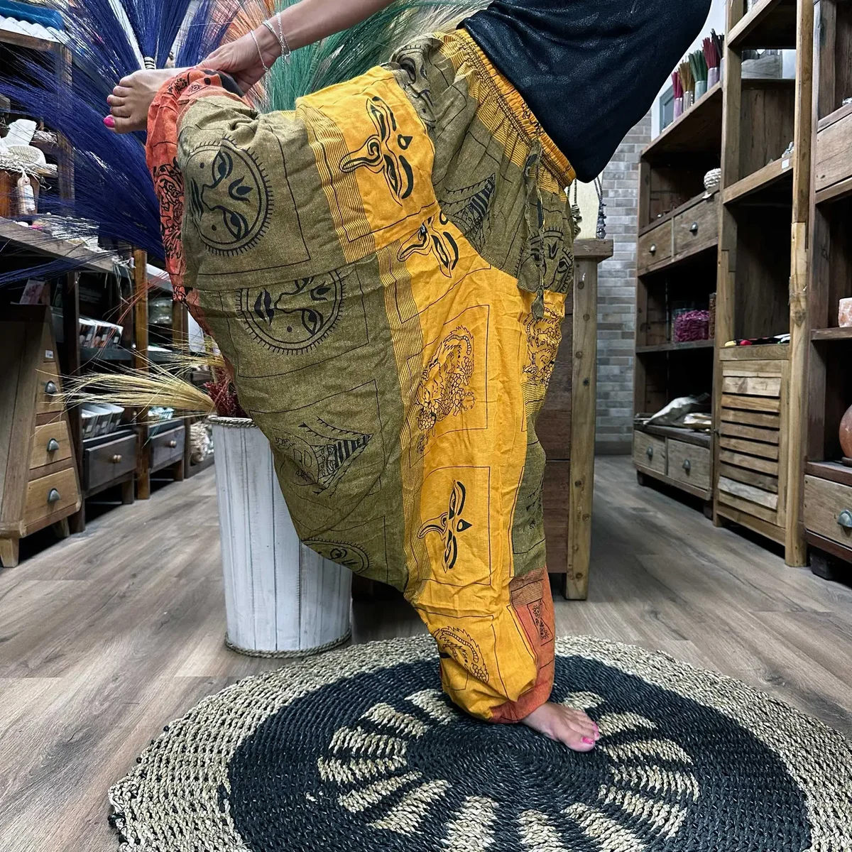 Orange yoga pants with Aladdin Himalayan print, designed for yoga and festival wear