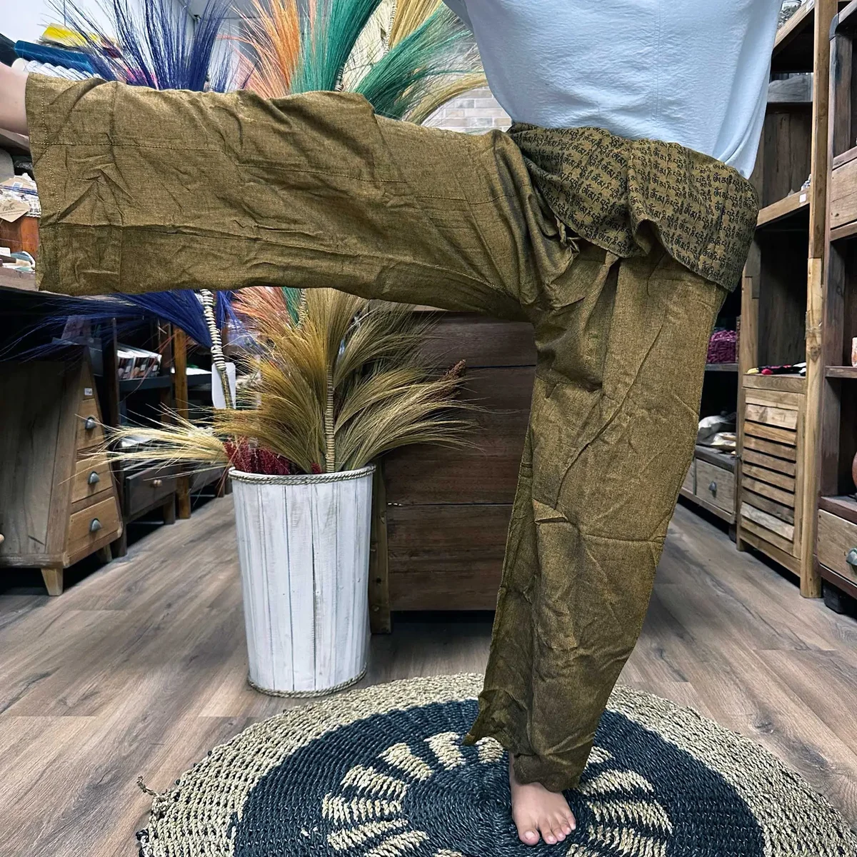 Orange yoga and festival pants with mandala mantra pattern, styled as traditional Thai fisherman pants