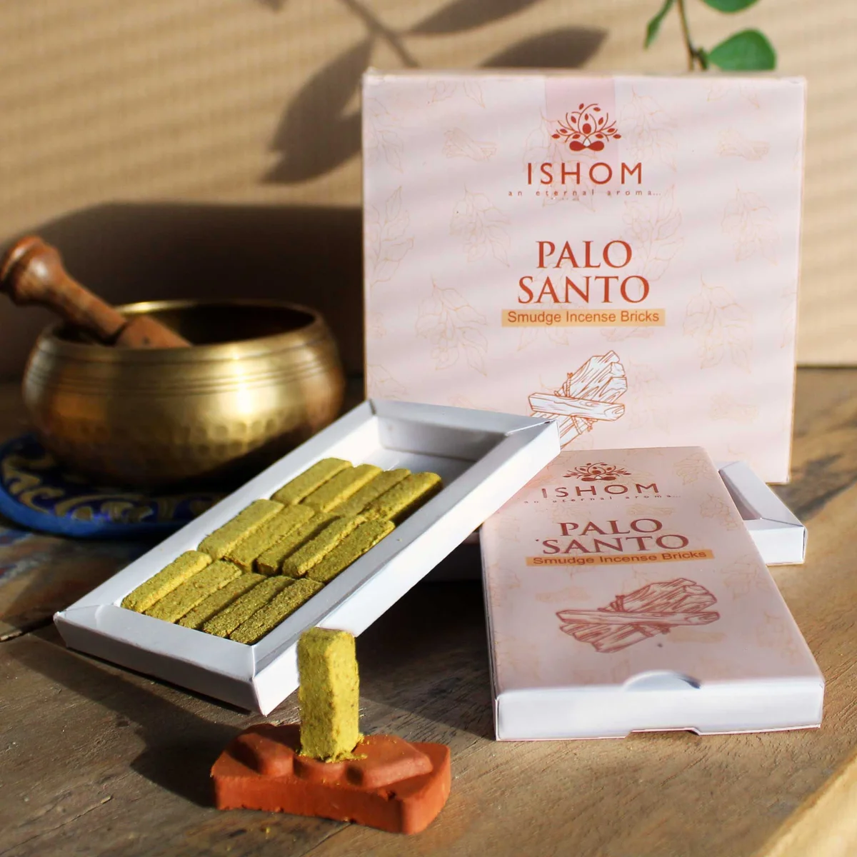 Pack of 15 natural incense smudge bricks with a wooden burner for Palo Santo incense use on a white background