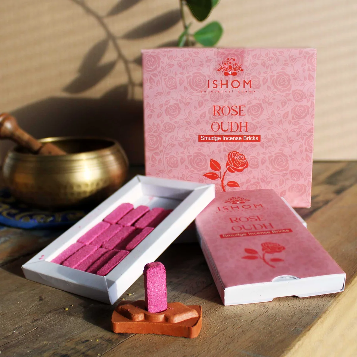 Pack of 15 natural incense smudge bricks with a rose wood burner arranged on a white background