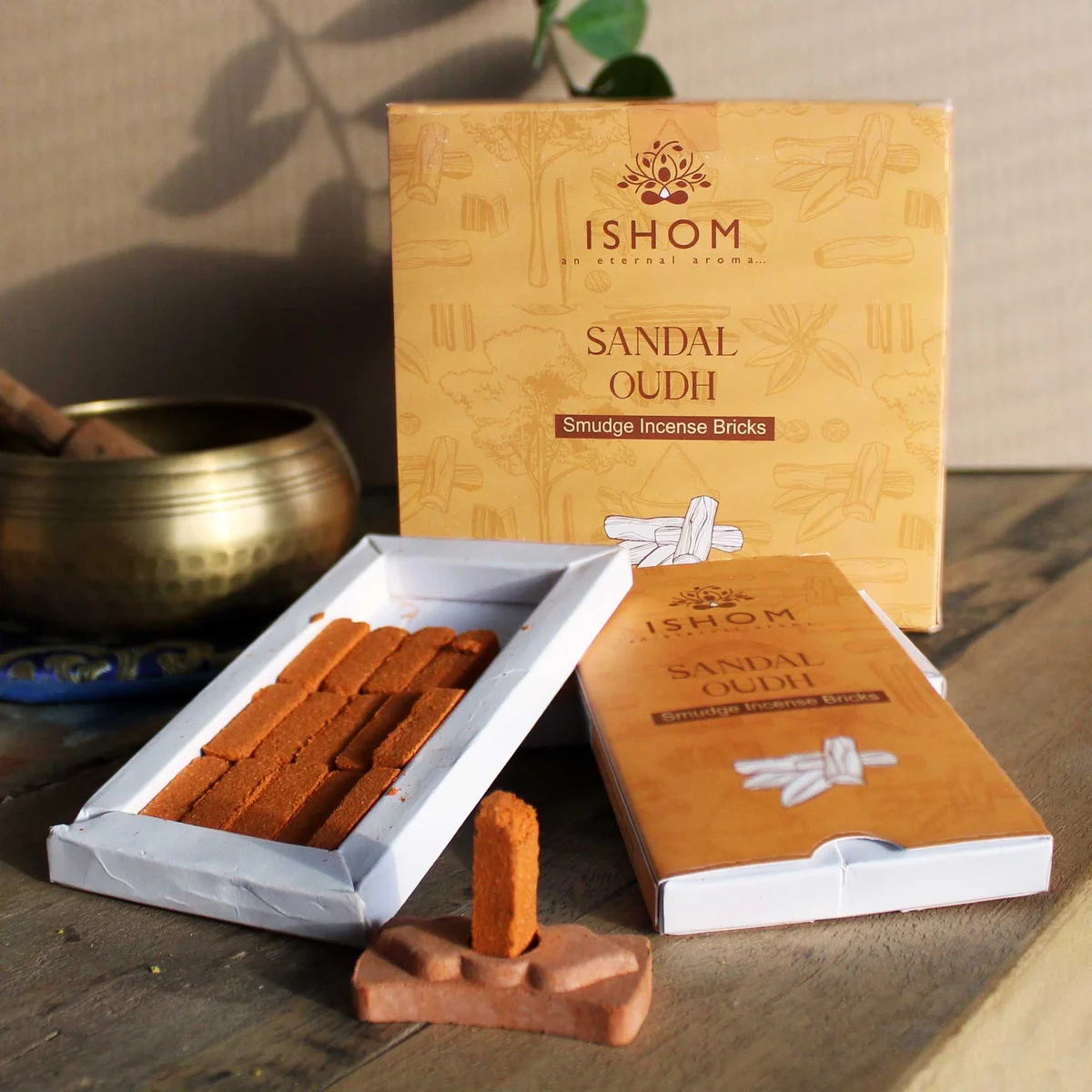 Pack of 15 natural incense smudge bricks with a wooden burner, sandalwood scent, arranged on a white background