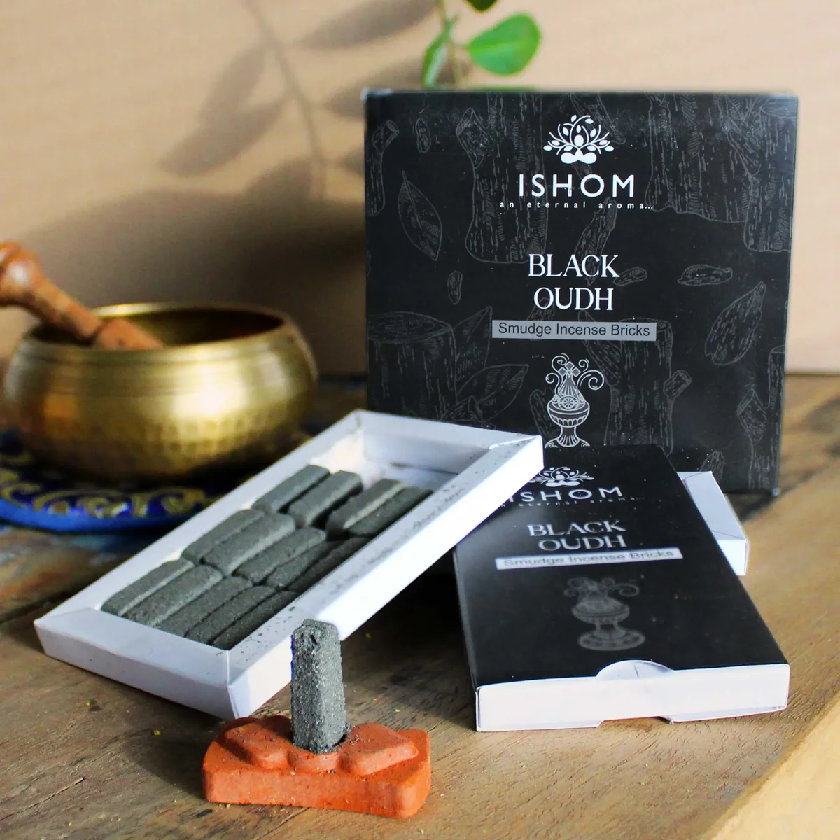 Pack of 15 natural incense smudge bricks with a black wood burner displayed on a white background