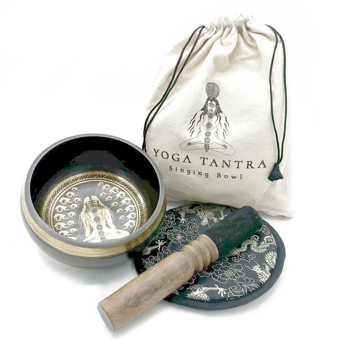 Hand beaten singing bowl 14cm with intricate engravings, wooden striker, and cushion in a gift set by Yogi
