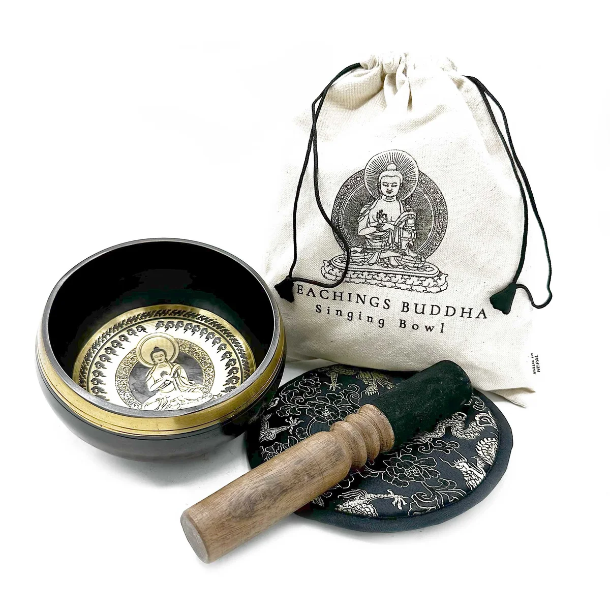 Hand beaten 14cm Buddha singing bowl gift with detailed engravings on the outer surface displayed on a wooden stand