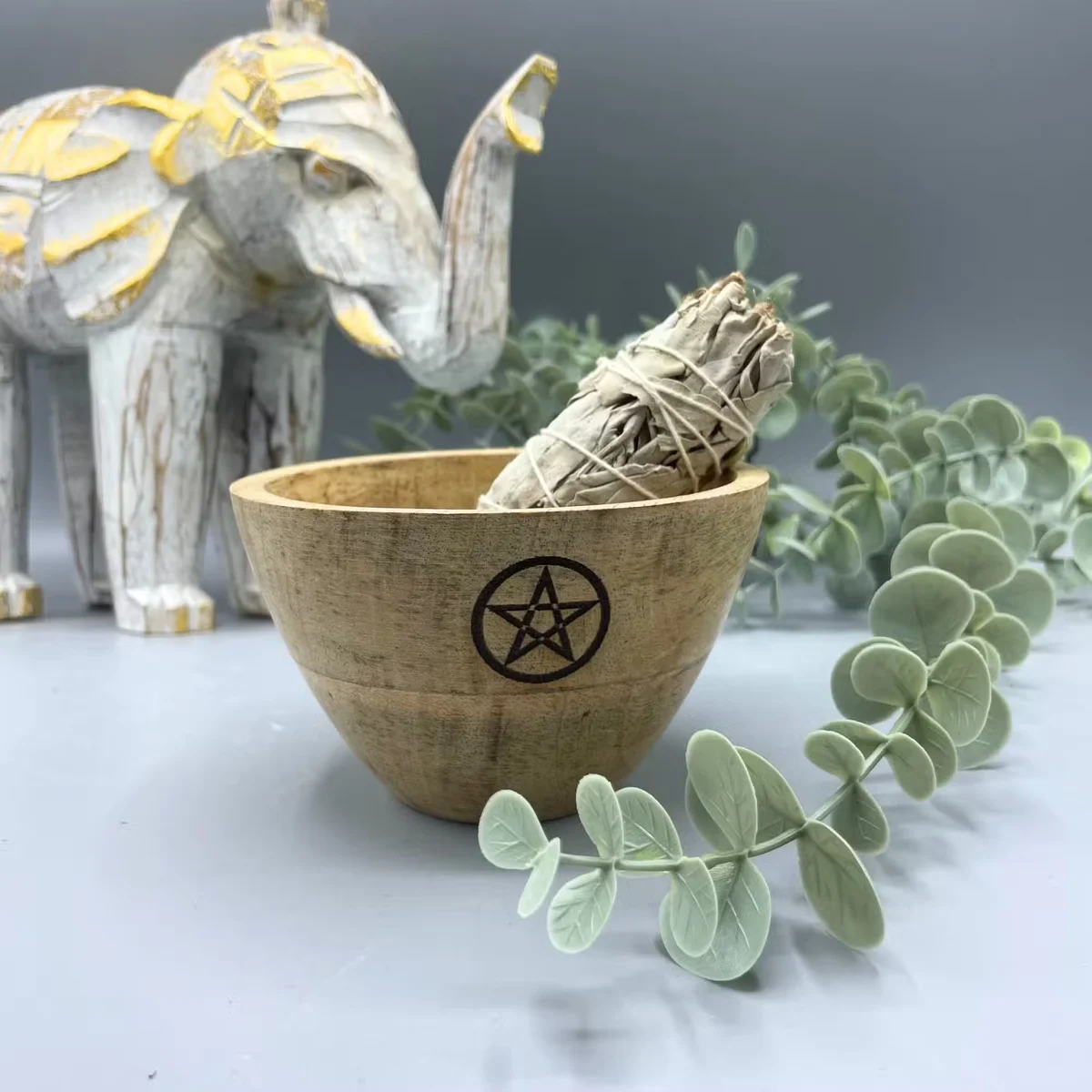 Wooden ritual offerings bowl with engraved pentagram design, measuring 11x7cm, shown on a plain background