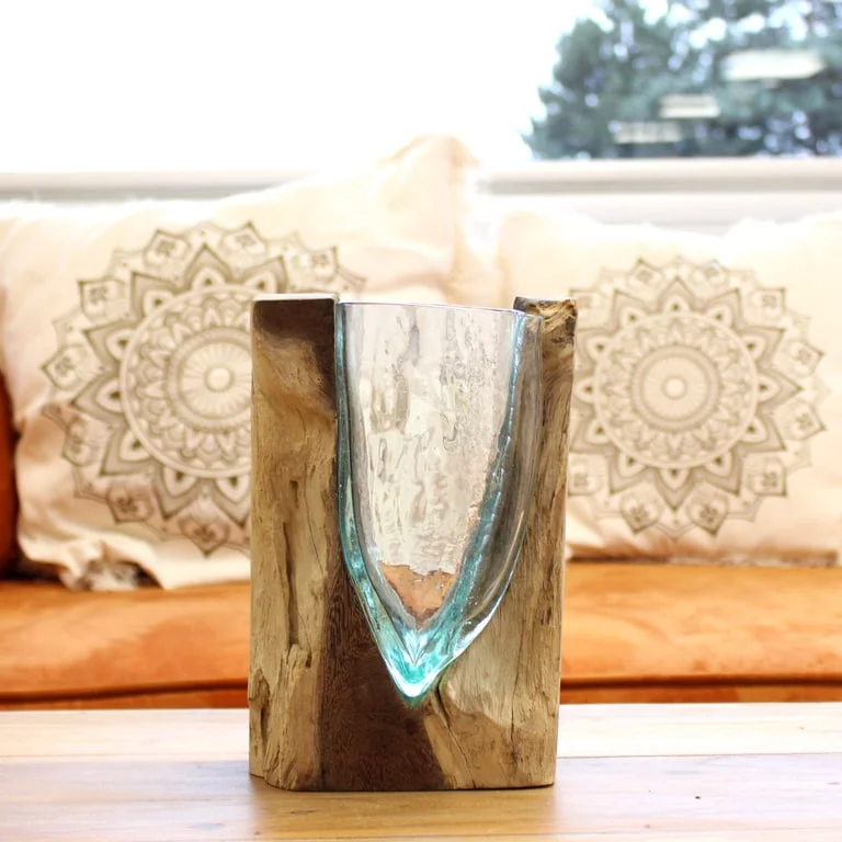 Unique glass vase with a V-shaped Molton glass design mounted on a wooden base, shown from the side on a white background