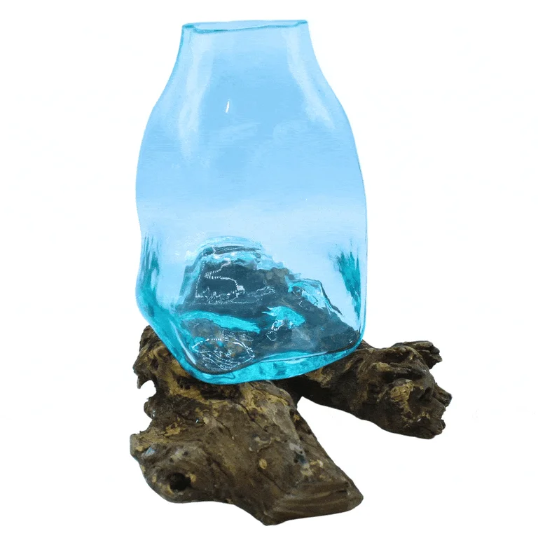 Large glass vase made of molten glass, shaped as a terrarium jar, resting on a wooden base
