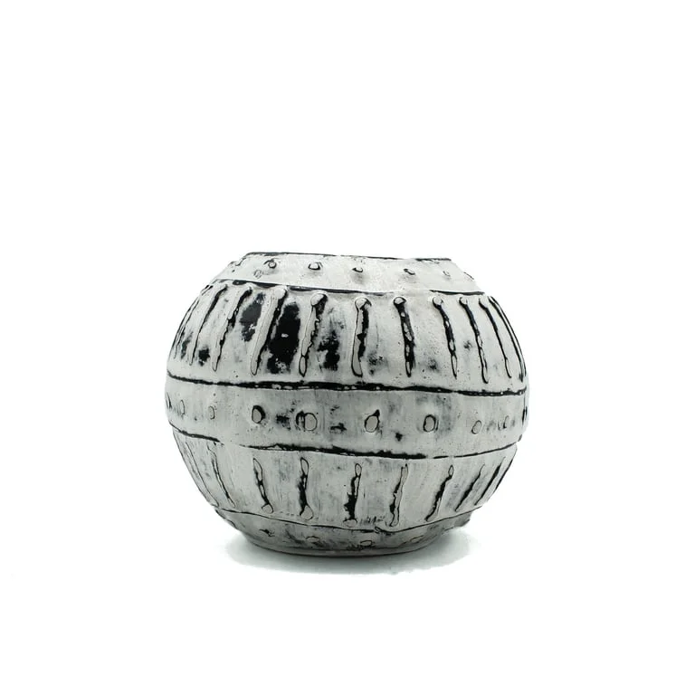 Cream plant pot made from Greek bubble clay, 10 cm tall, shown in photo.