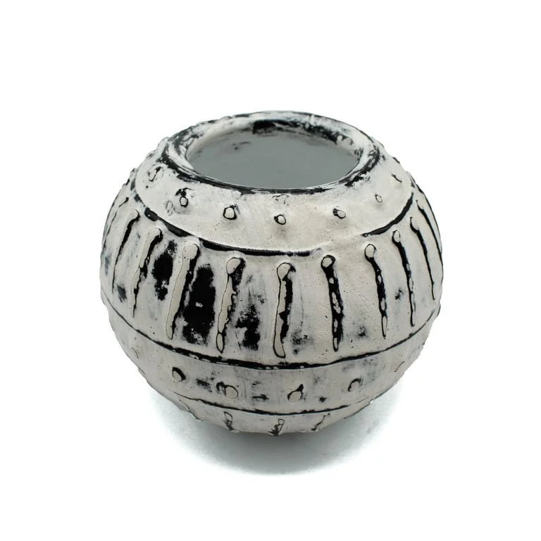Cream coloured Greek bubble clay plant pot, 10cm tall, showcasing its round smooth shape