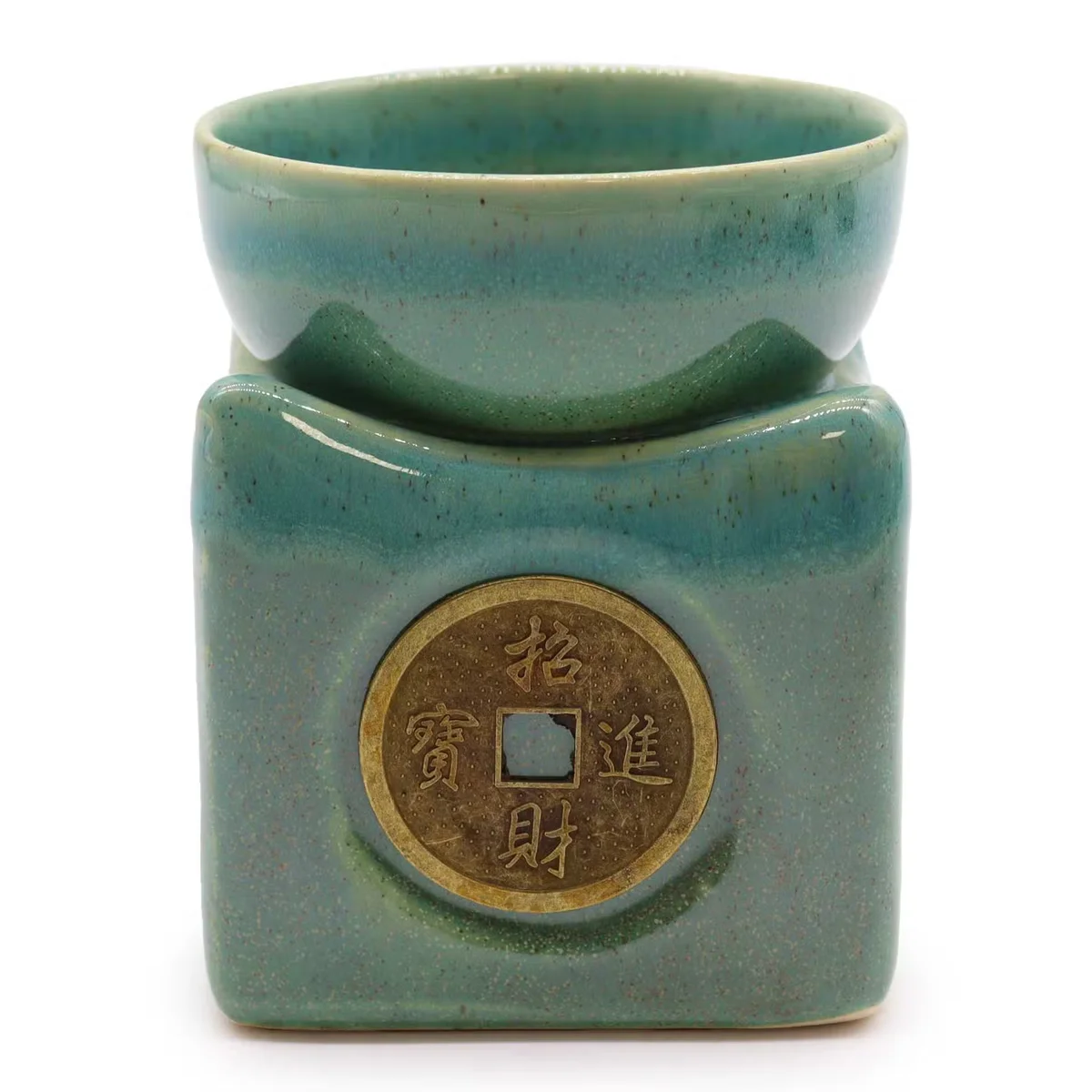 Large jade decorative oil burner with a lucky coin design, used for heating scented oils at home
