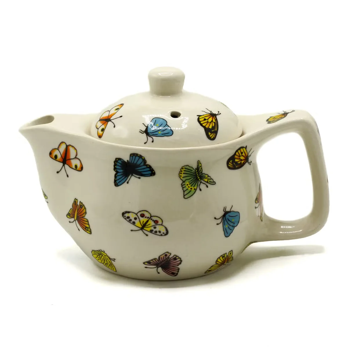 Small teapot featuring butterfly pattern, translucent ceramic body with charming butterfly decorations.