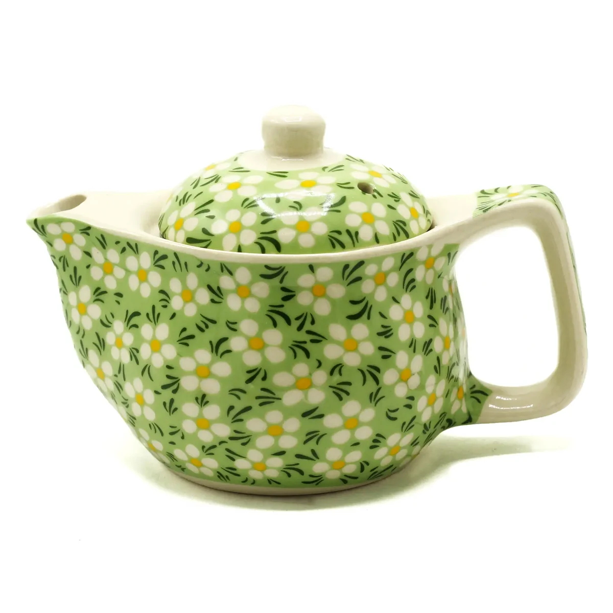Small green daisey teapot, a herbal tea pot in a simple background