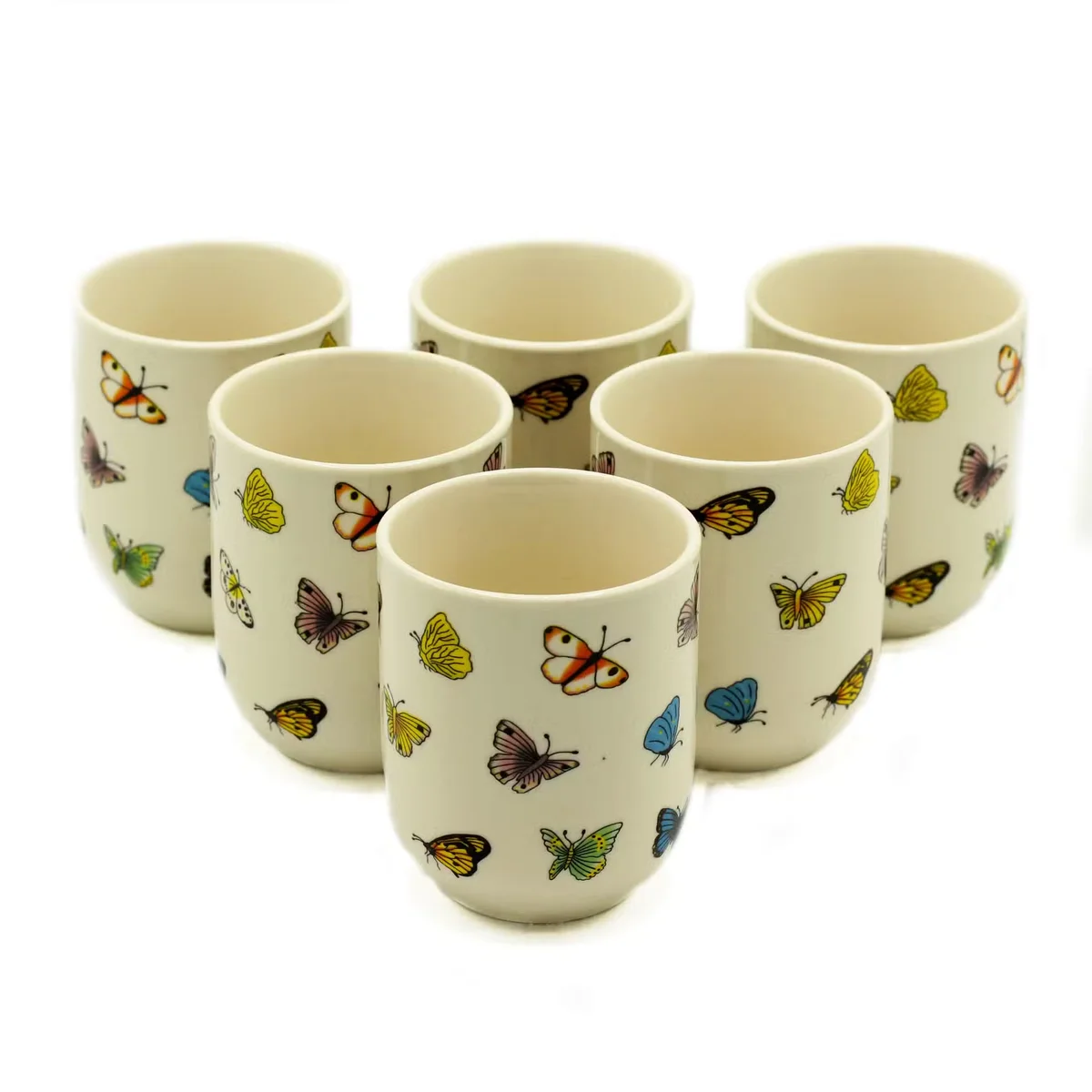 Stylish kitchen tea cups featuring butterfly design on ceramic, ideal for herbal tea.