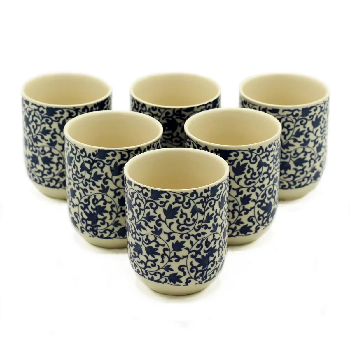 Blue pattern mug with herbal tea cup design, ceramic body showcasing blue motifs, side view with handle and stopper.