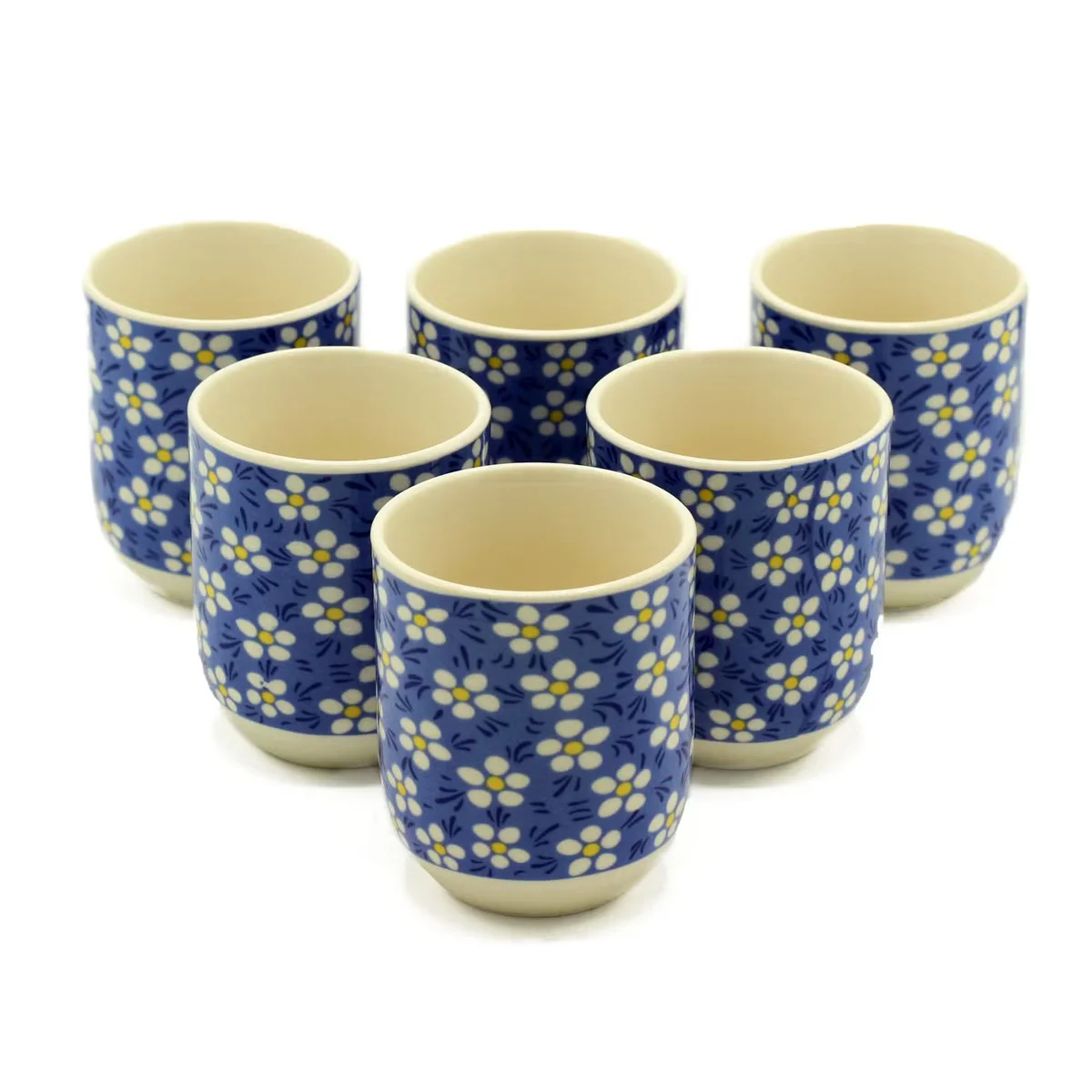 Herbal tea mug featuring blue daisy pattern, elegant ceramic design.
