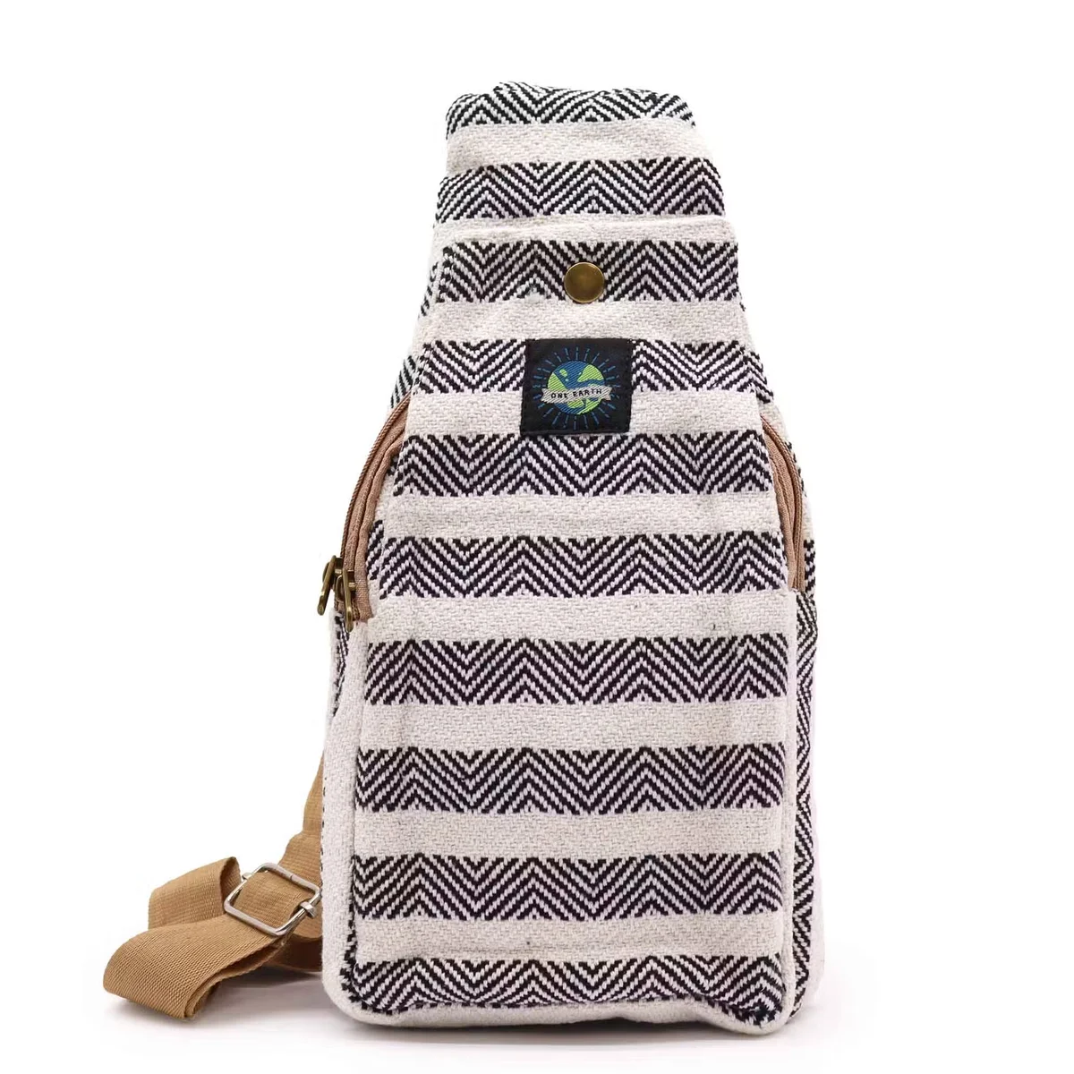 Black and white crossbody cotton bag made from natural cotton, shown hanging with adjustable strap and simple design