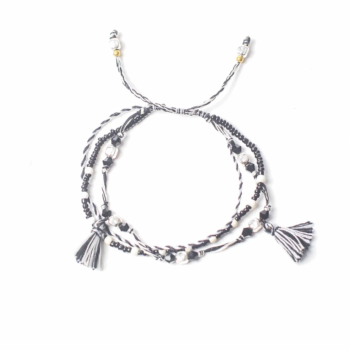 Temple string bracelet with nature-inspired design.