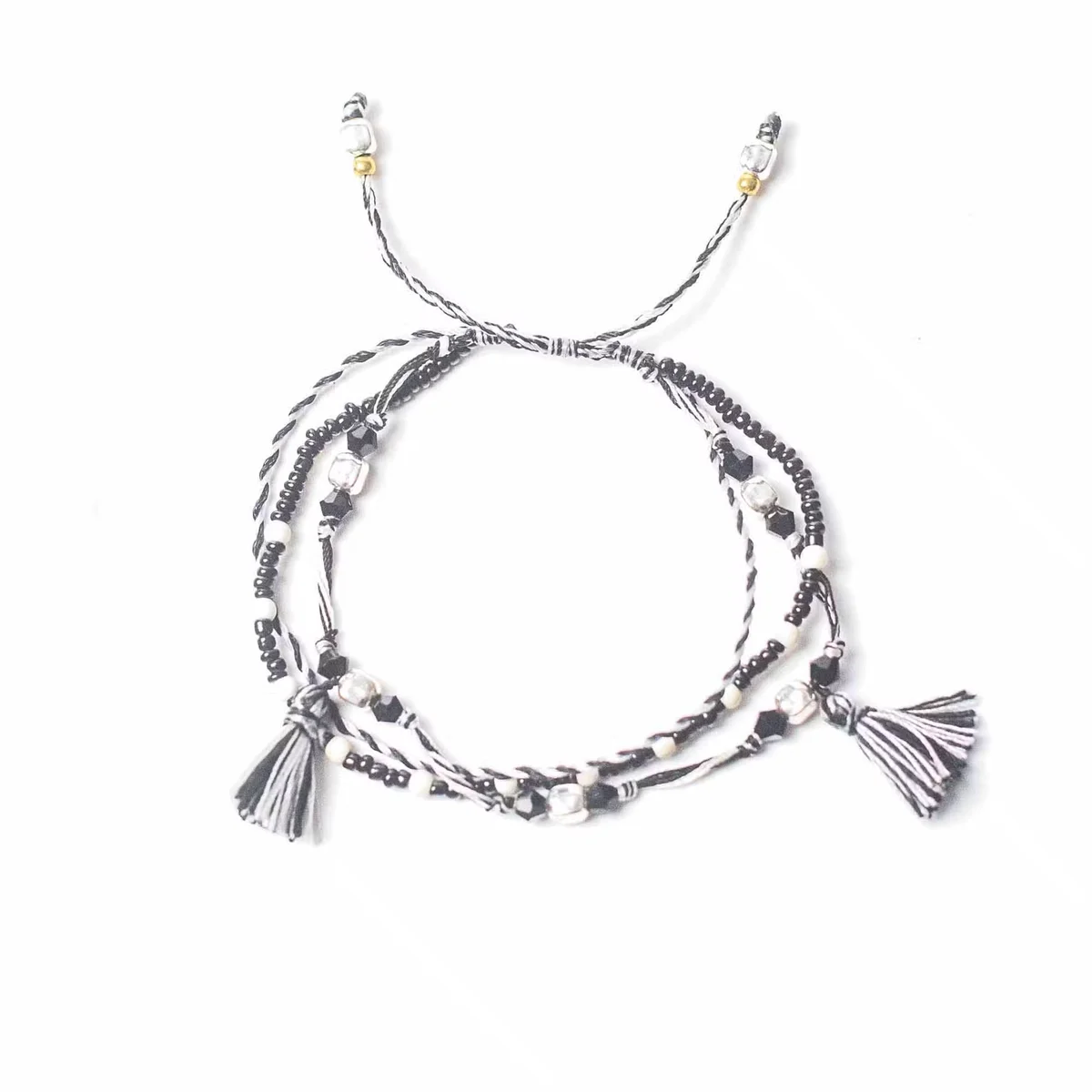 Temple bracelet with a delicate stringed design, evoking a balance of nature.
