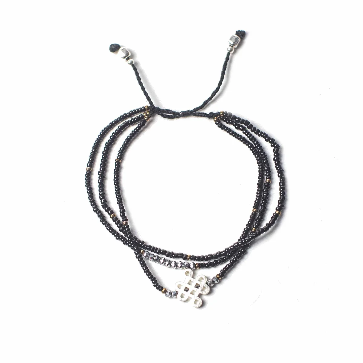Temple string bracelet on flat surface, simple string design, spiritual bracelet UK