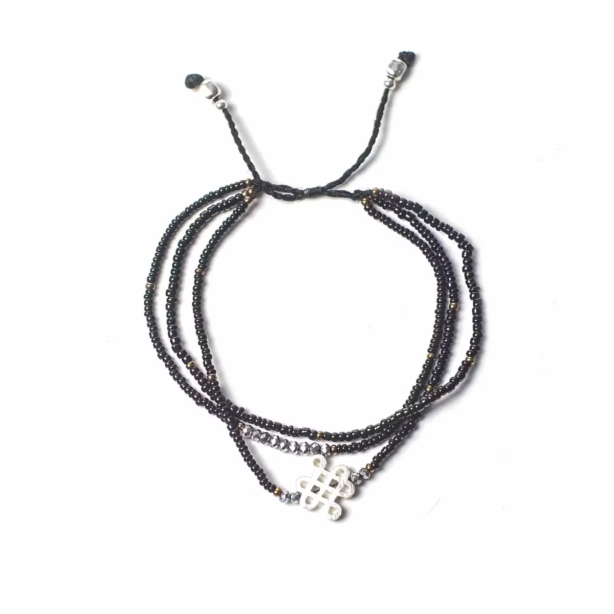 Temple string bracelet for grounding, beads woven on a slender chain, wearing on wrist.
