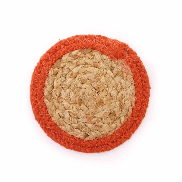 Four natural jute coasters with cotton weave, 10cm diameter, arranged on a flat surface.