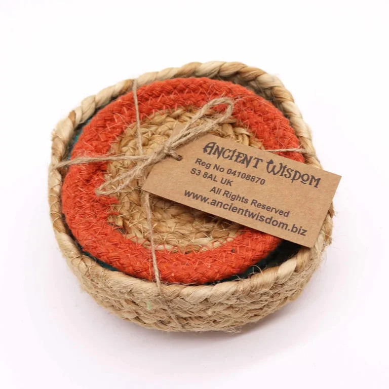 Set of six natural jute coasters in mixed colours arranged in a basket.