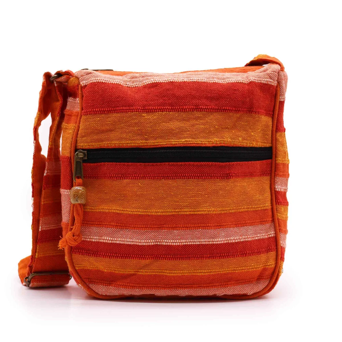 Large orange sling bag with adjustable strap, front zippered pocket, worn on a shoulder.