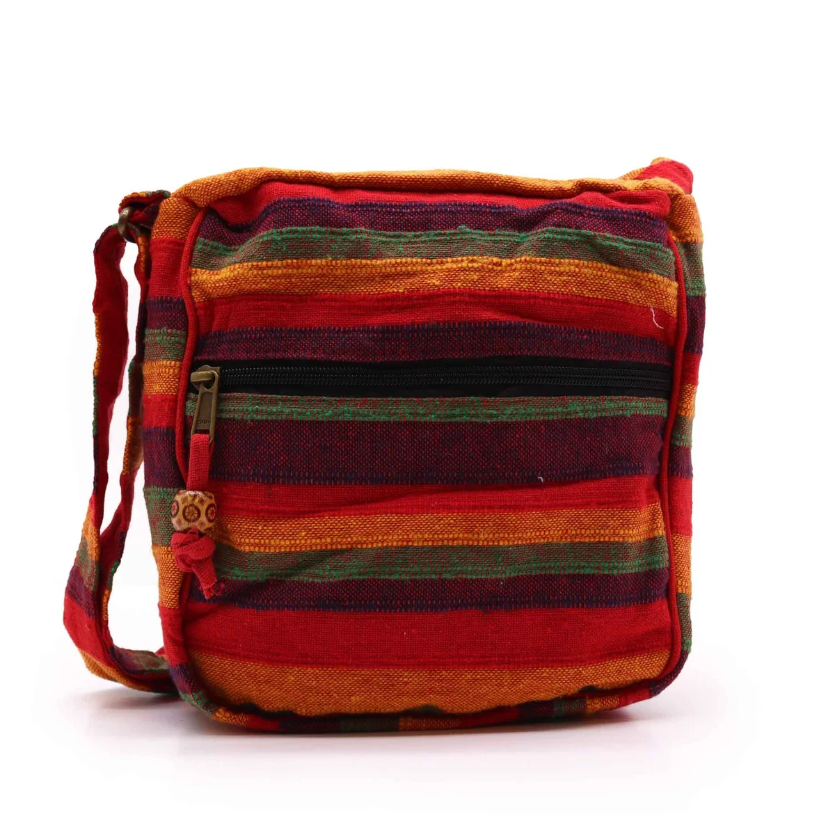 large Nepal sling bag in sunset red with adjustable strap, worn slung over shoulder