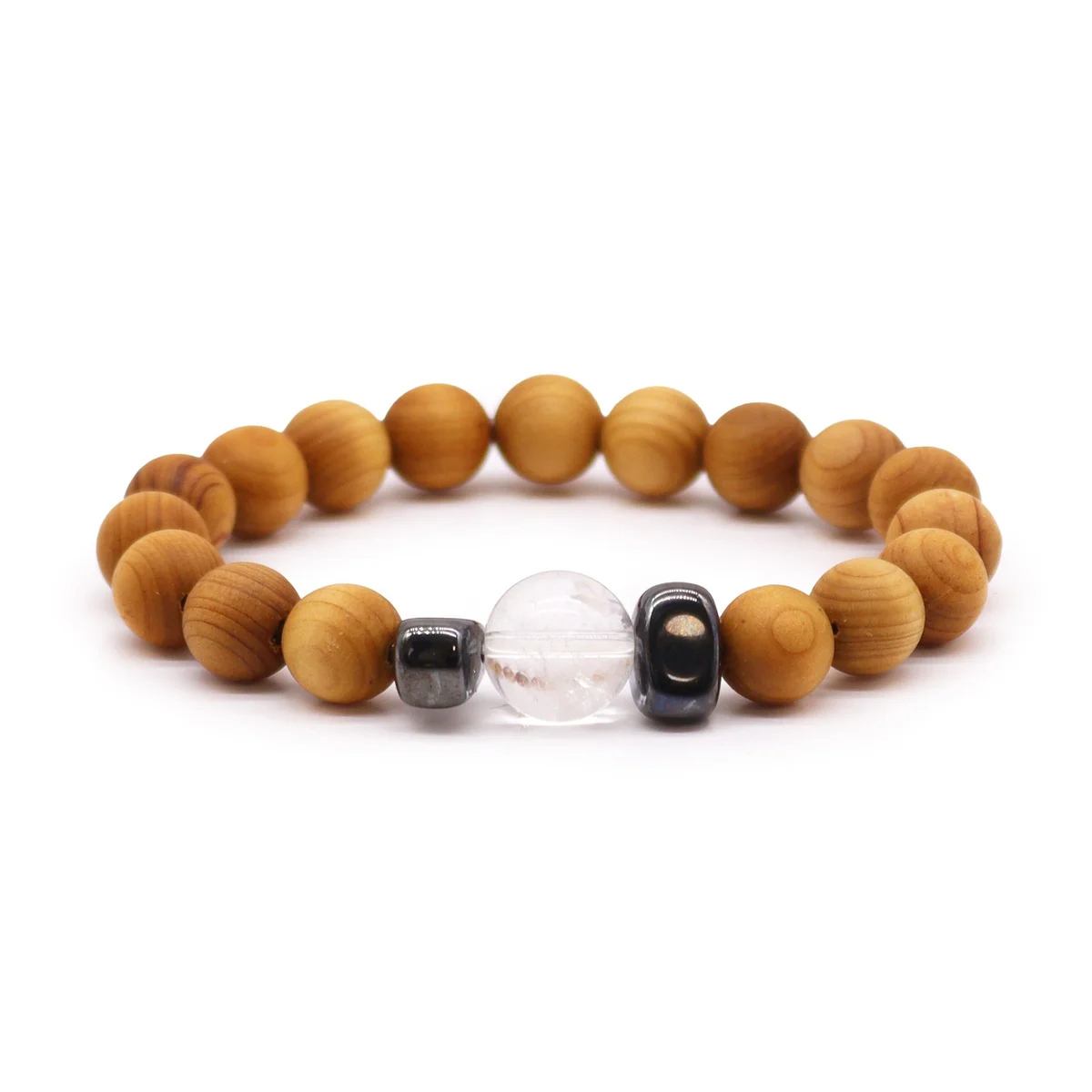 cedarwood chakra bangle with clear quartz stone, worn on the wrist.