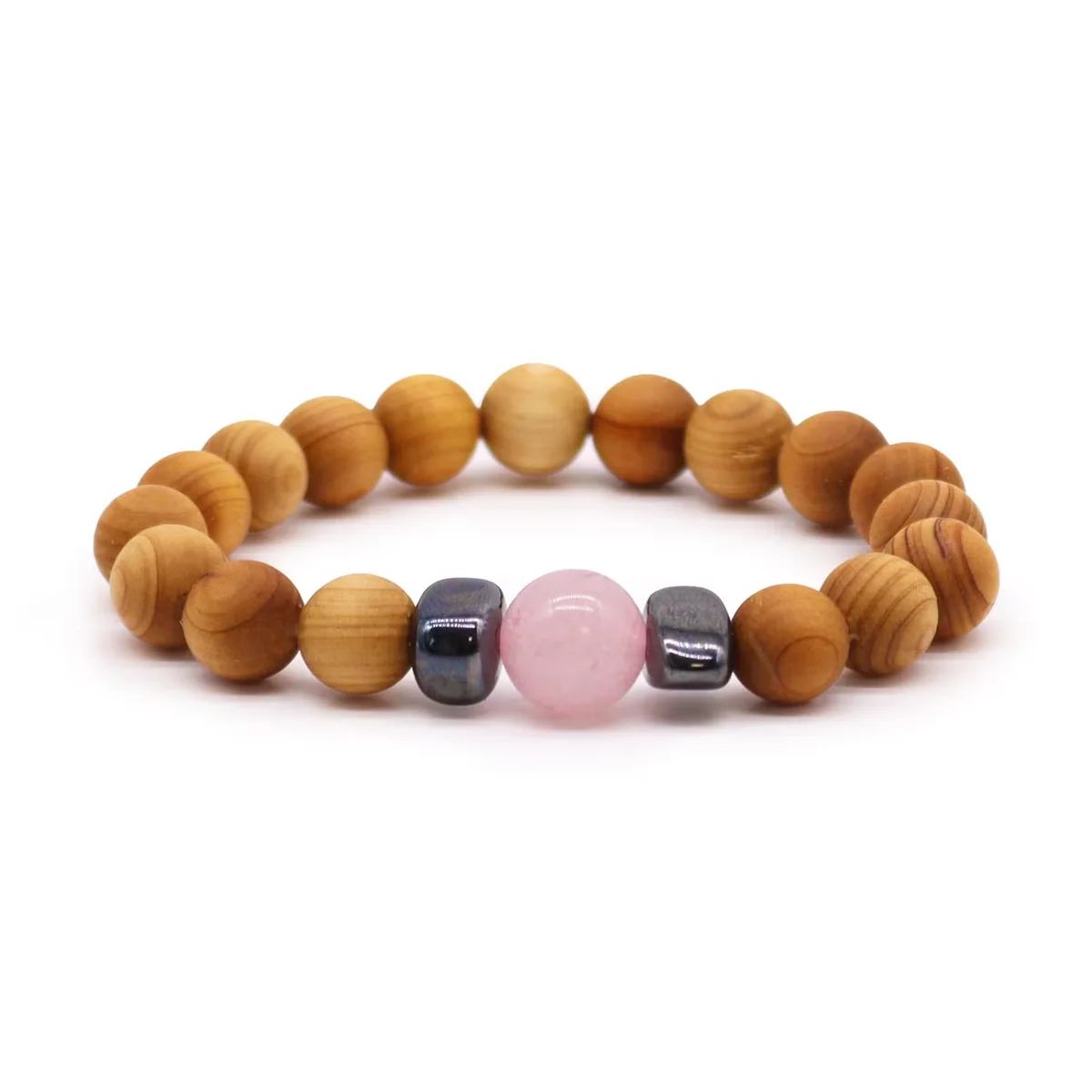 Cedarwood heart‑shaped chakra bracelet with rose quartz beads, a piece of chakra jewellery.