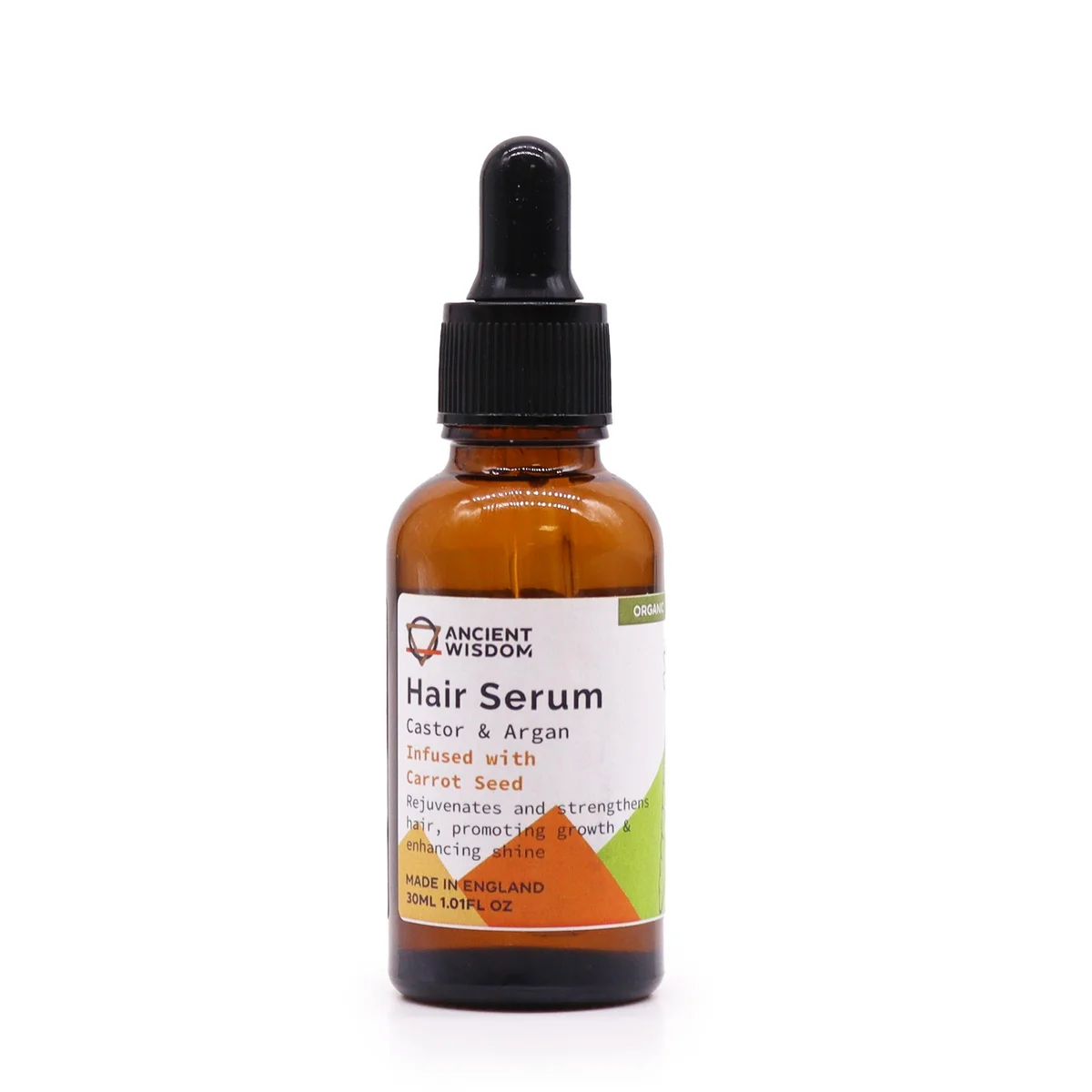 30ml bottle of organic hair serum with carrot seed extract on plain background