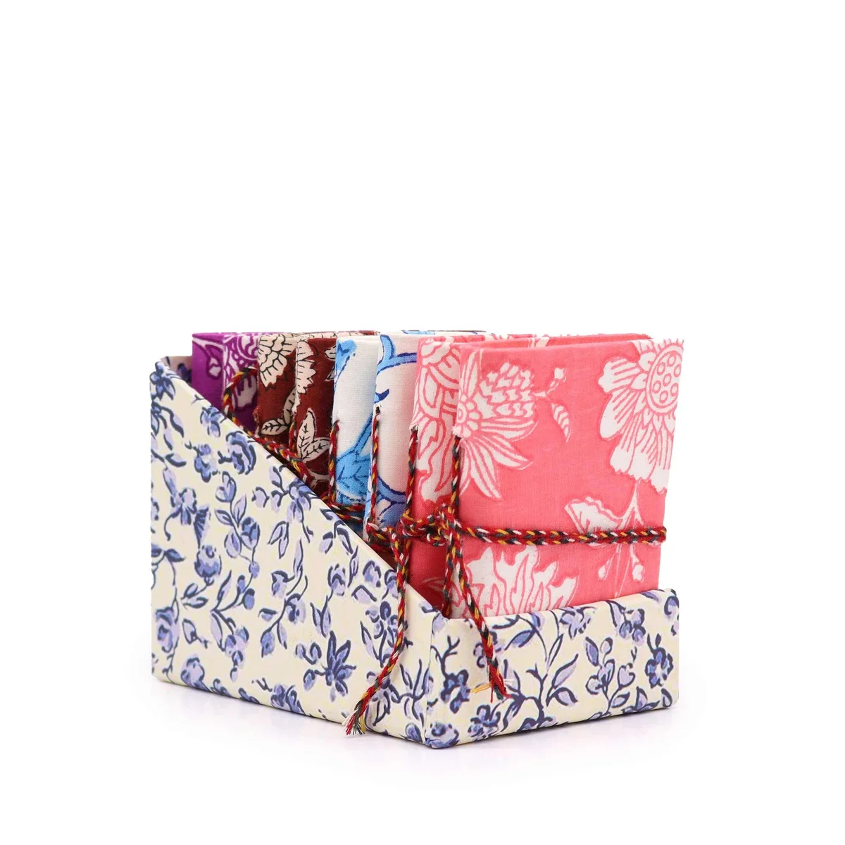 Assorted 7x10cm cotton bound notebooks featuring a floral print in a bundled display.