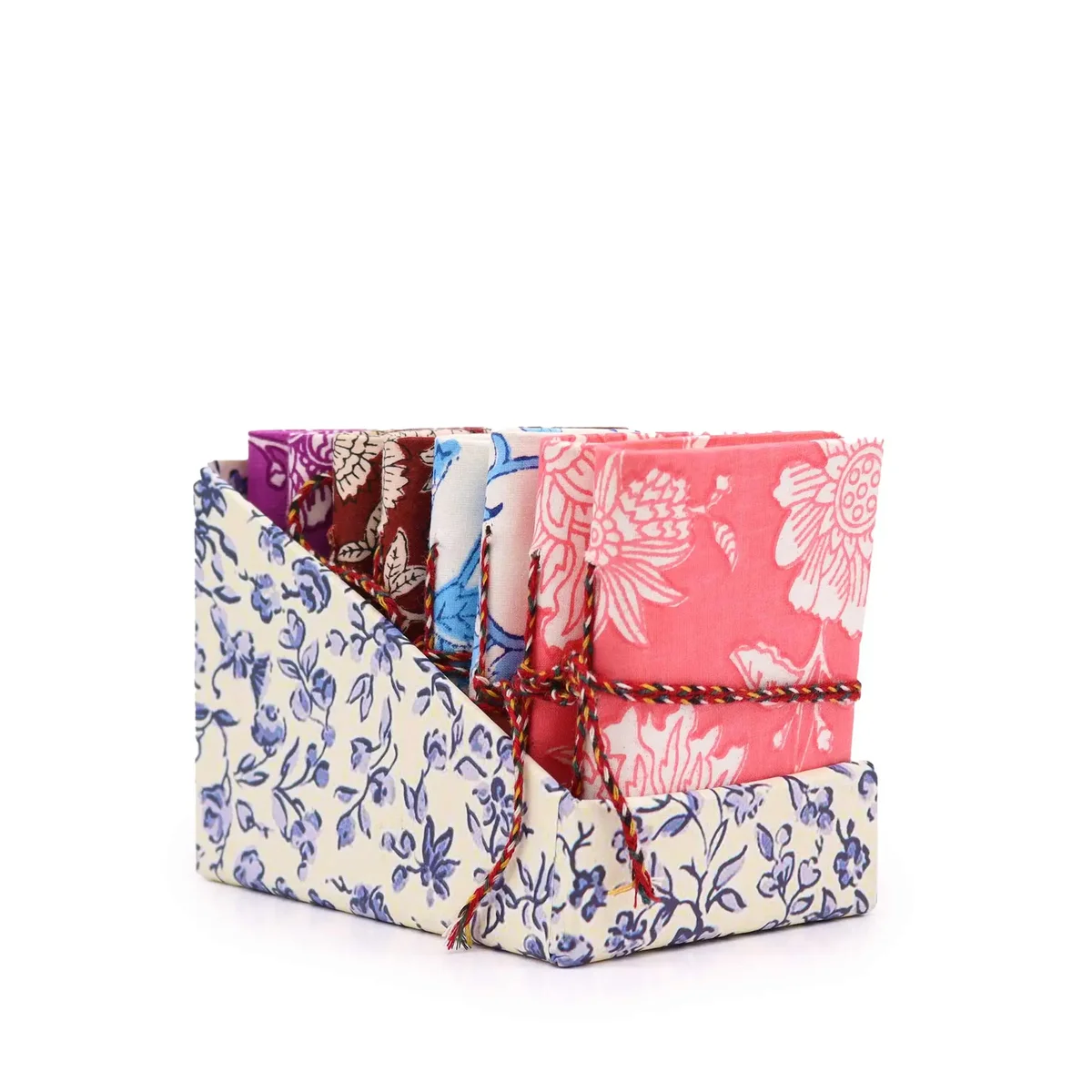 Floral printed cotton bound notebooks (7x10cm) in assorted colours displayed together.
