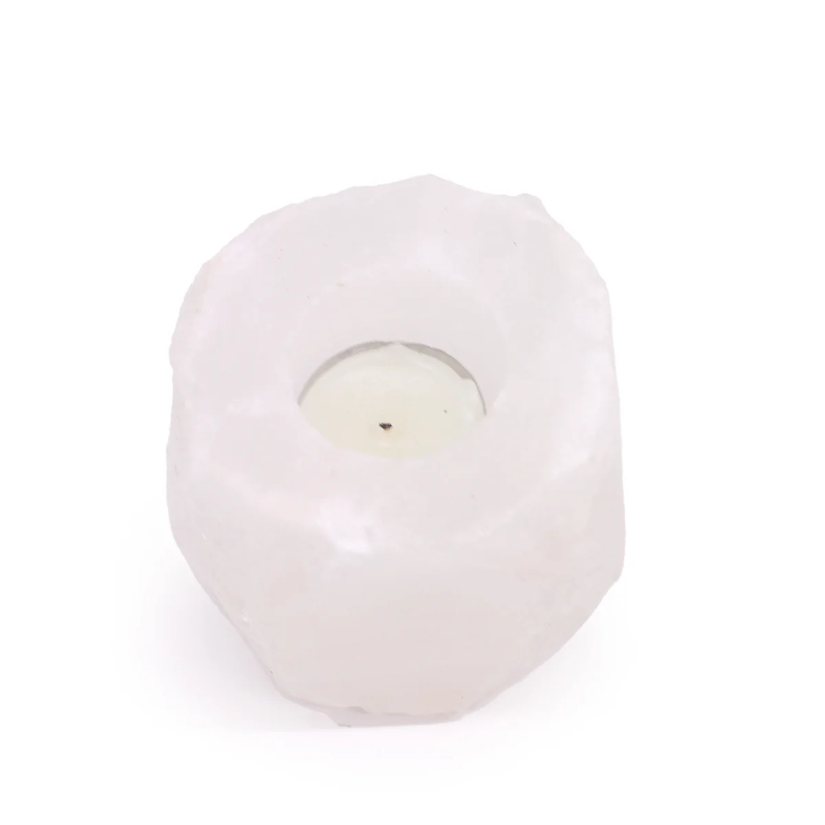 Natural salt candle holder made from crystal rock Himalayan salt weighing 600-800g shown on white background
