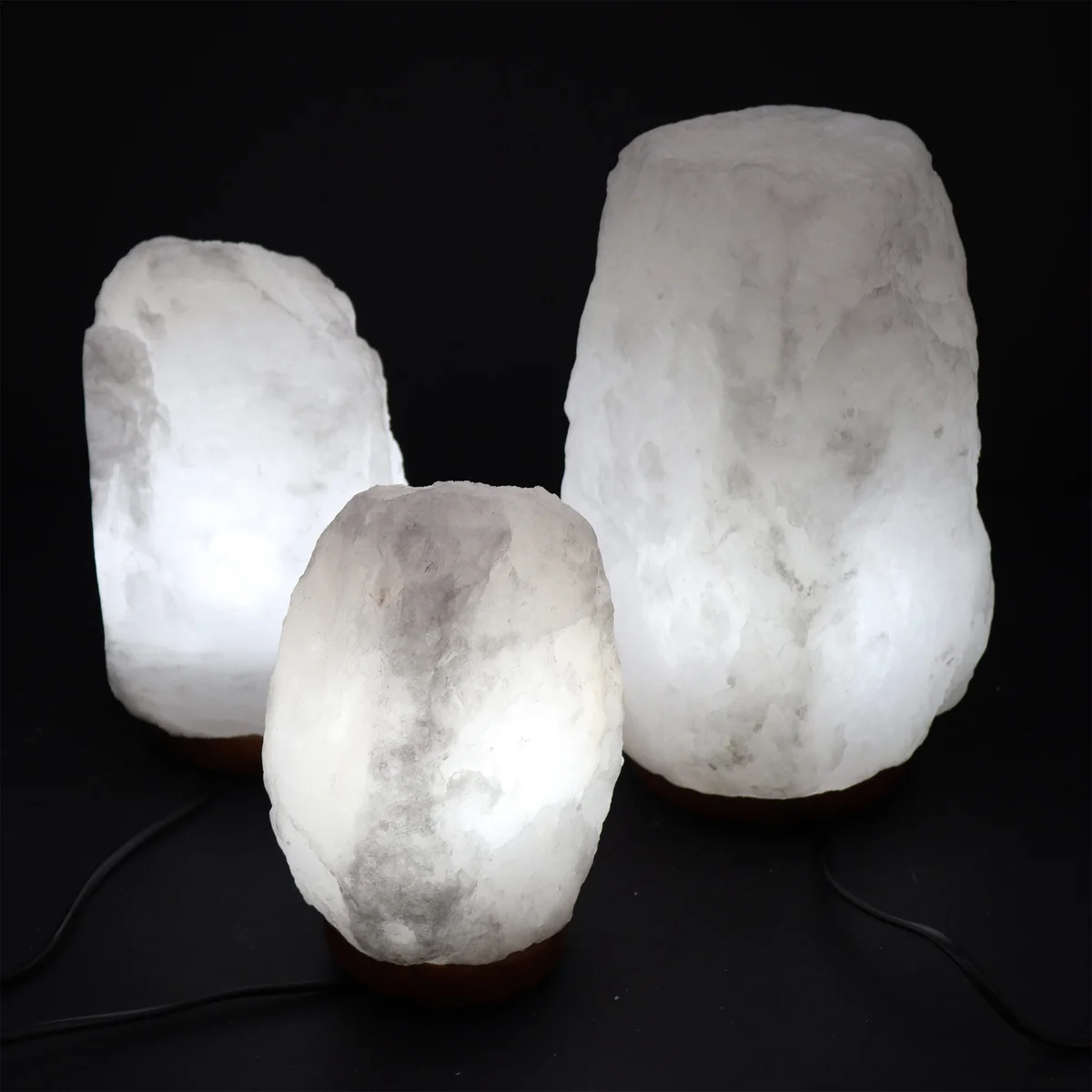 Natural salt lamp made from Himalayan crystal rock on a wooden base, weighing approximately 2-3kg