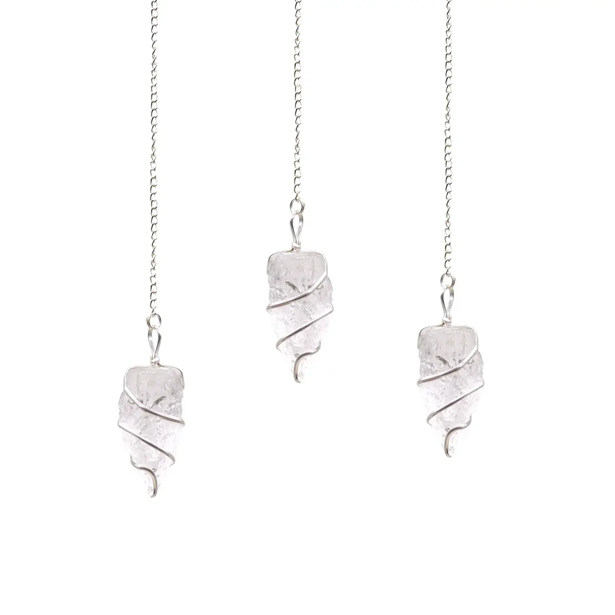 Raw rock quartz pendulum with a pointed crystal suspended from a chain on a white background