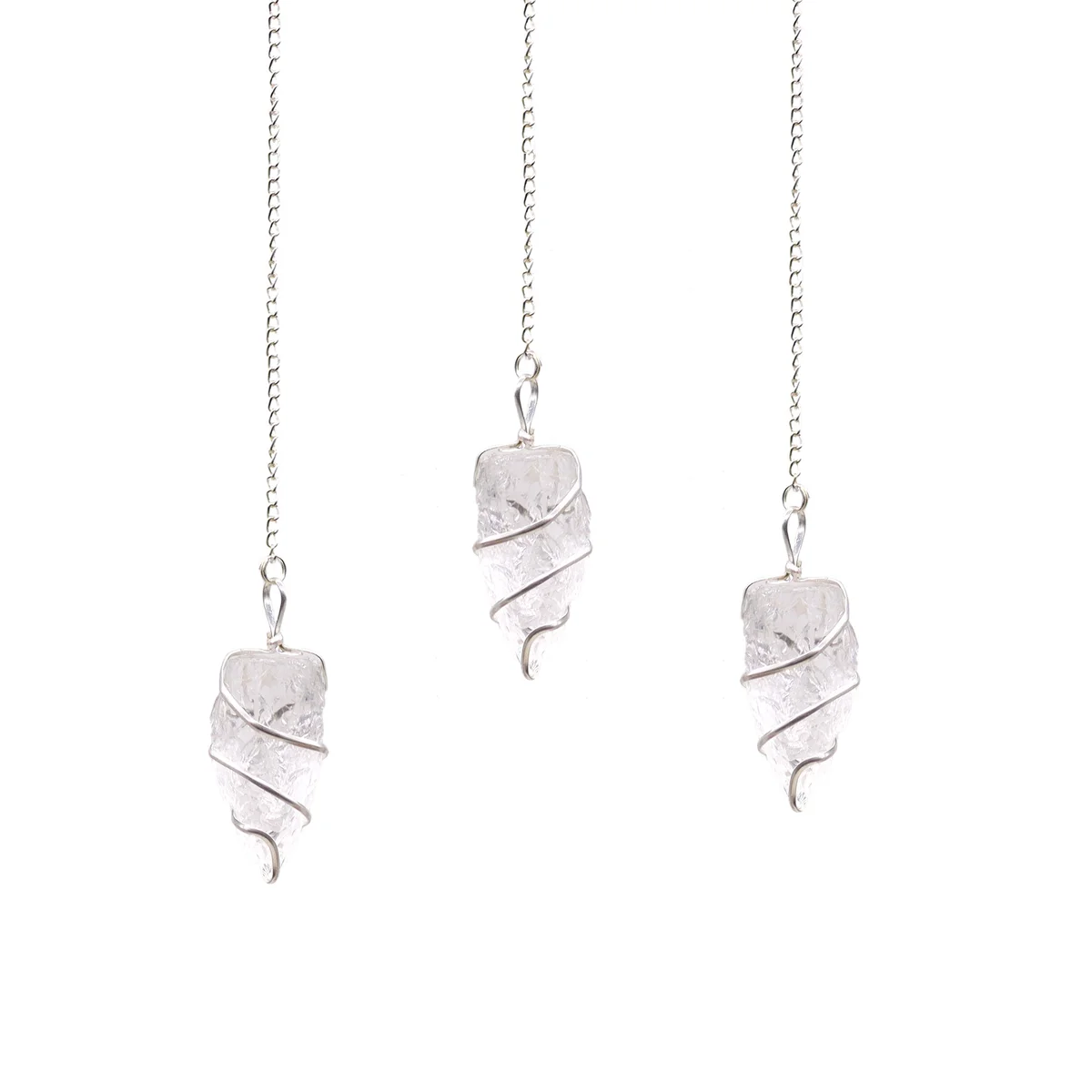 Raw rock quartz gemstone pendulum hanging from a natural gemstone necklace against a white background