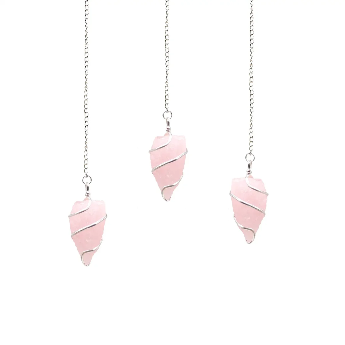 Raw gemstone pendulum made of pink rose quartz crystal with a pointed tip and attached chain for dowsing or divination