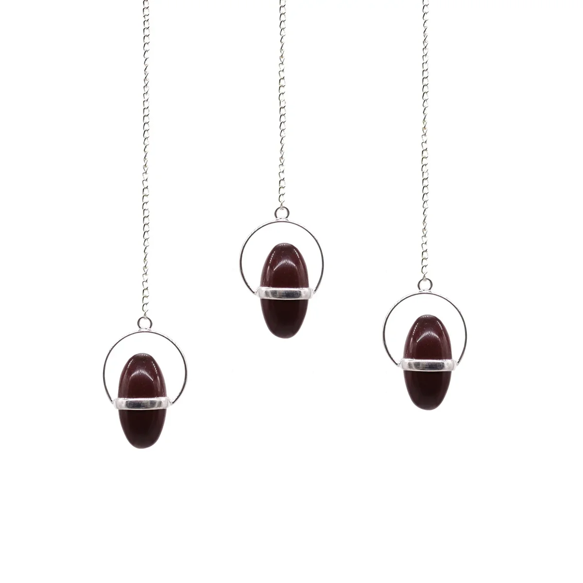 Shiva Lingam ornament with a band pendulum displayed on a white background