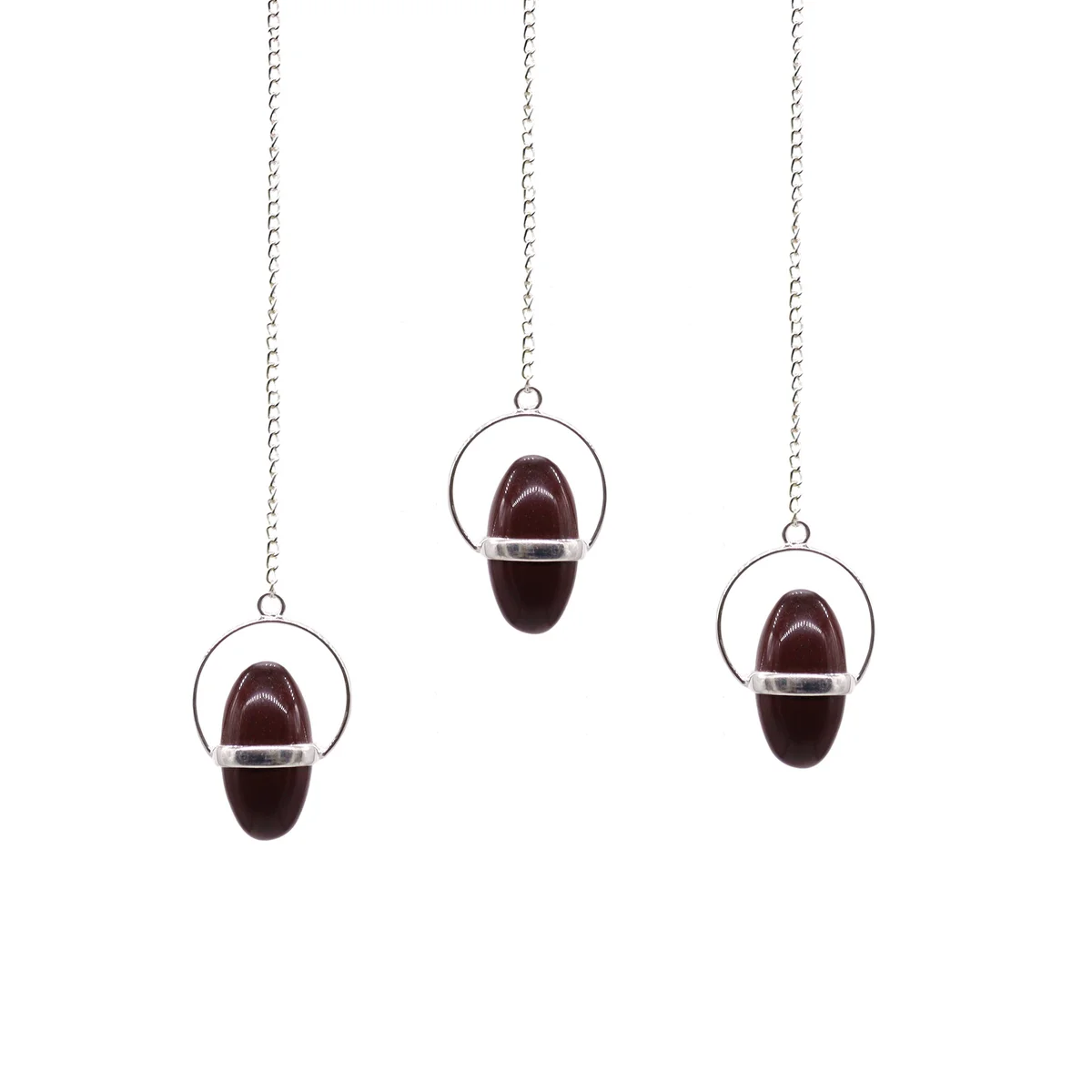 Shiva Lingam stone with attached band pendulum decor displayed on a white background