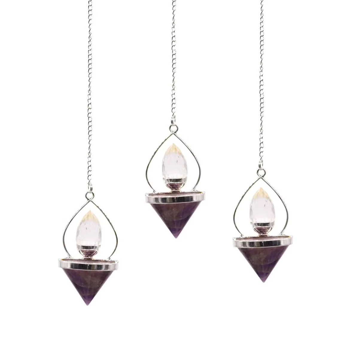 Amethyst and rock quartz pendulum hanging from a silver chain, showcasing gemstone lantern design against white background