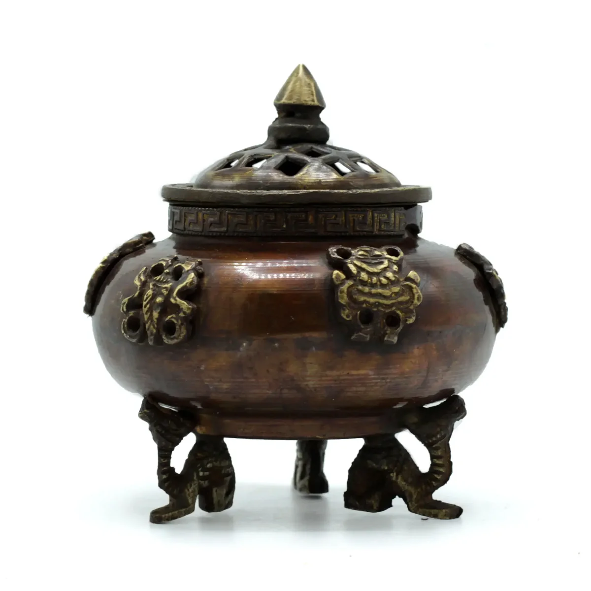 Brass Tibetan incense holder shaped as a six symbols standing pot with intricate detailing on a white background
