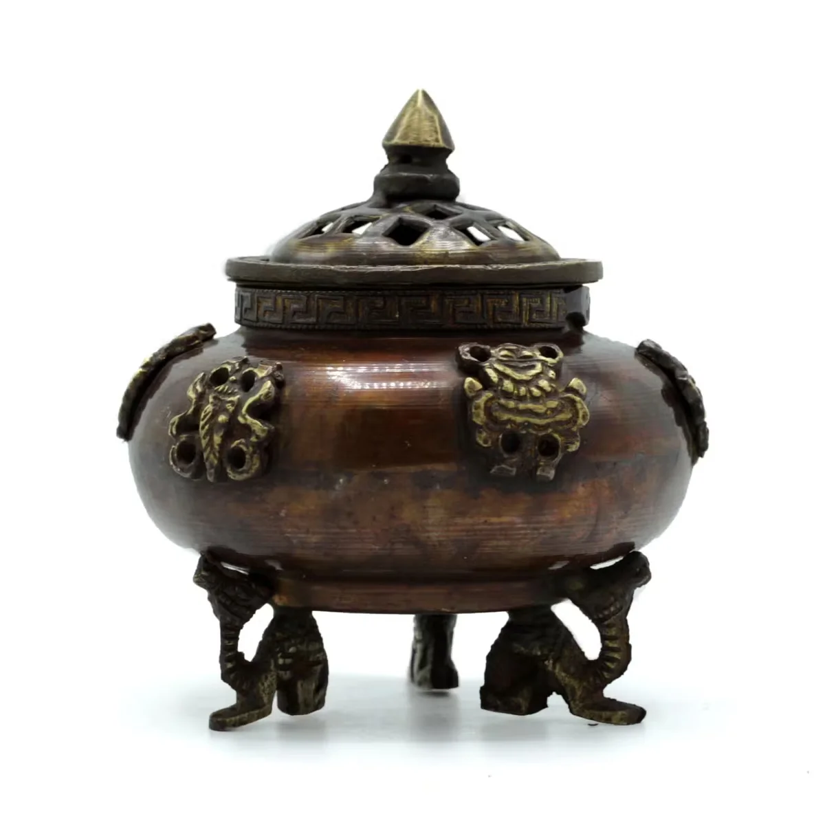 Brass standing incense burner with six Tibetan symbols, ornate design, and sturdy pot shape on a white background