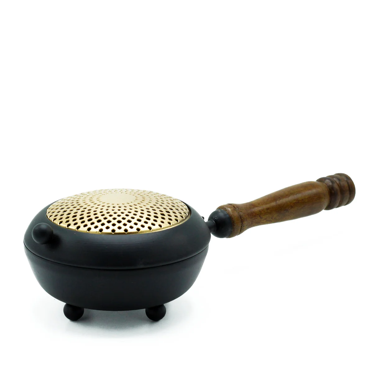 Large iron censer incense burner with intricate gold detail on a decorative base